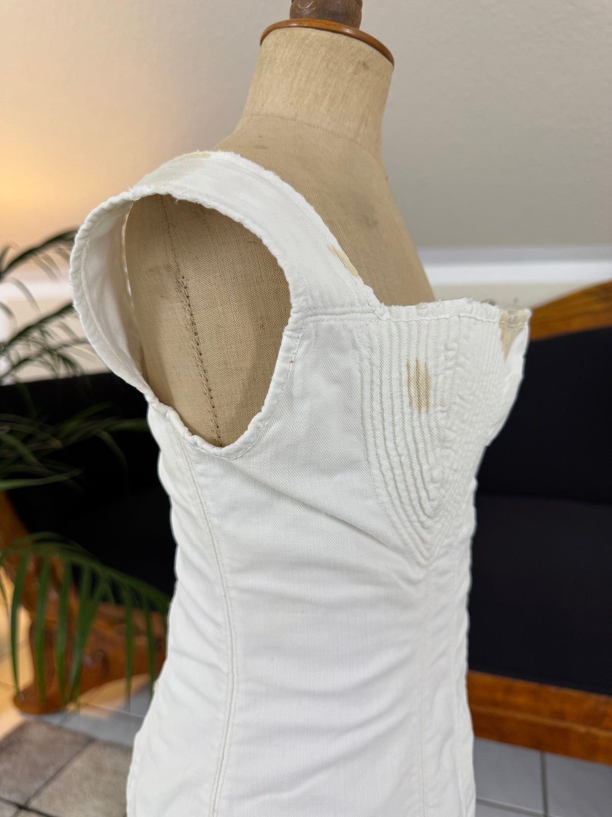 Antique corded cotton corset ca. 1825–1830 with shaped bust, bone eyelets and handwritten owner’s name, early 19th‑century Regency corsetry
