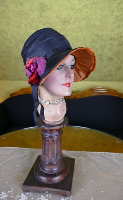 Schwarz-orangefarbene Glocke im Haubenstil, ca. 1926