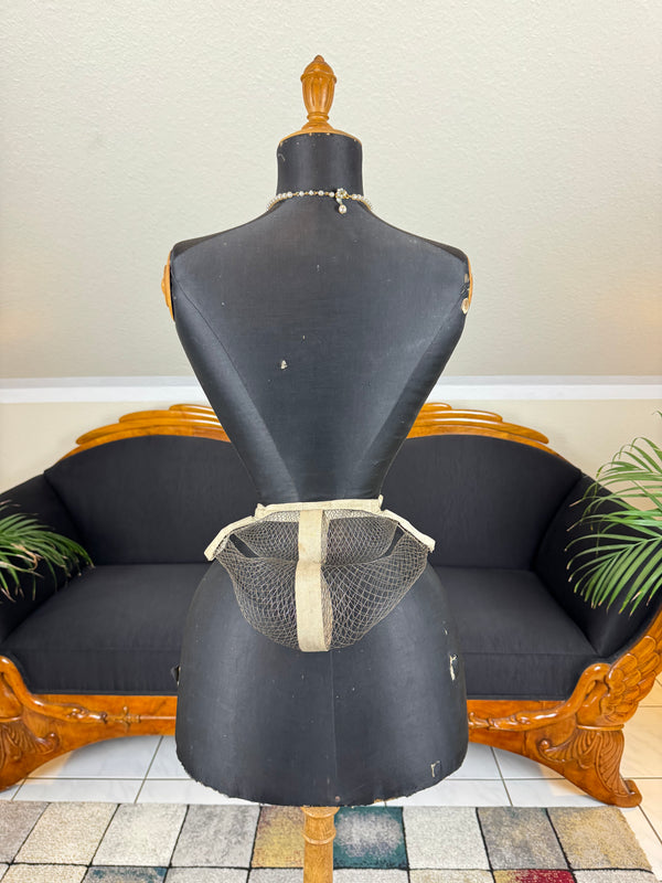American Braided Wire Co. late 19th‑century wire work bustle with braided wire coils and cream canvas waistband.