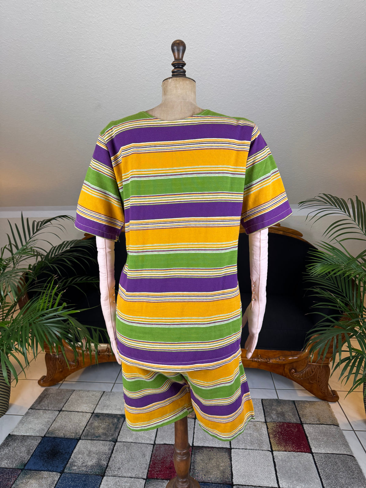 1920s bathing costume with short‑sleeved top and striped shorts