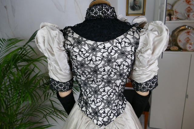 Antique silk dress 1890s — detailed view of sleeves, lace and fabric texture