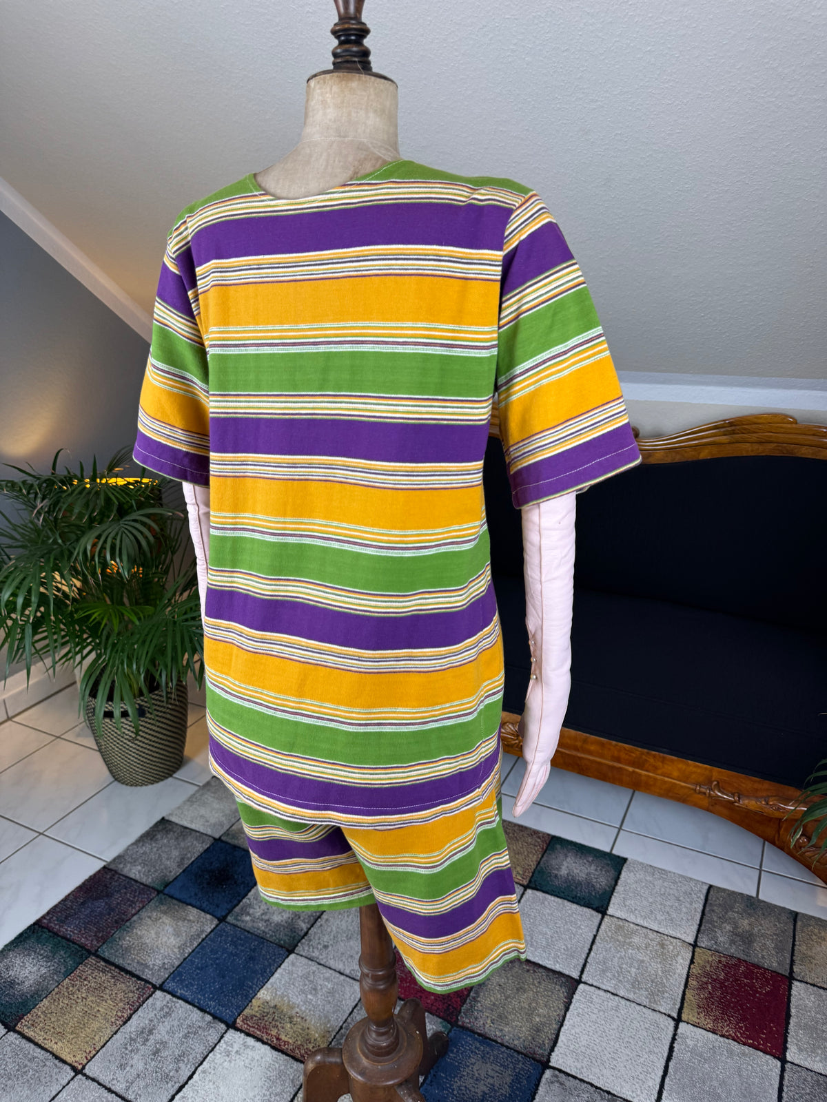 1920s bathing costume with short‑sleeved top and striped shorts