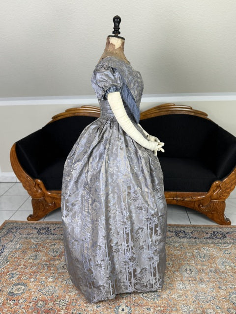 1845 Austrian Biedermeier evening dress in ivory silk with puffed sleeves and fitted bodice, antique gown