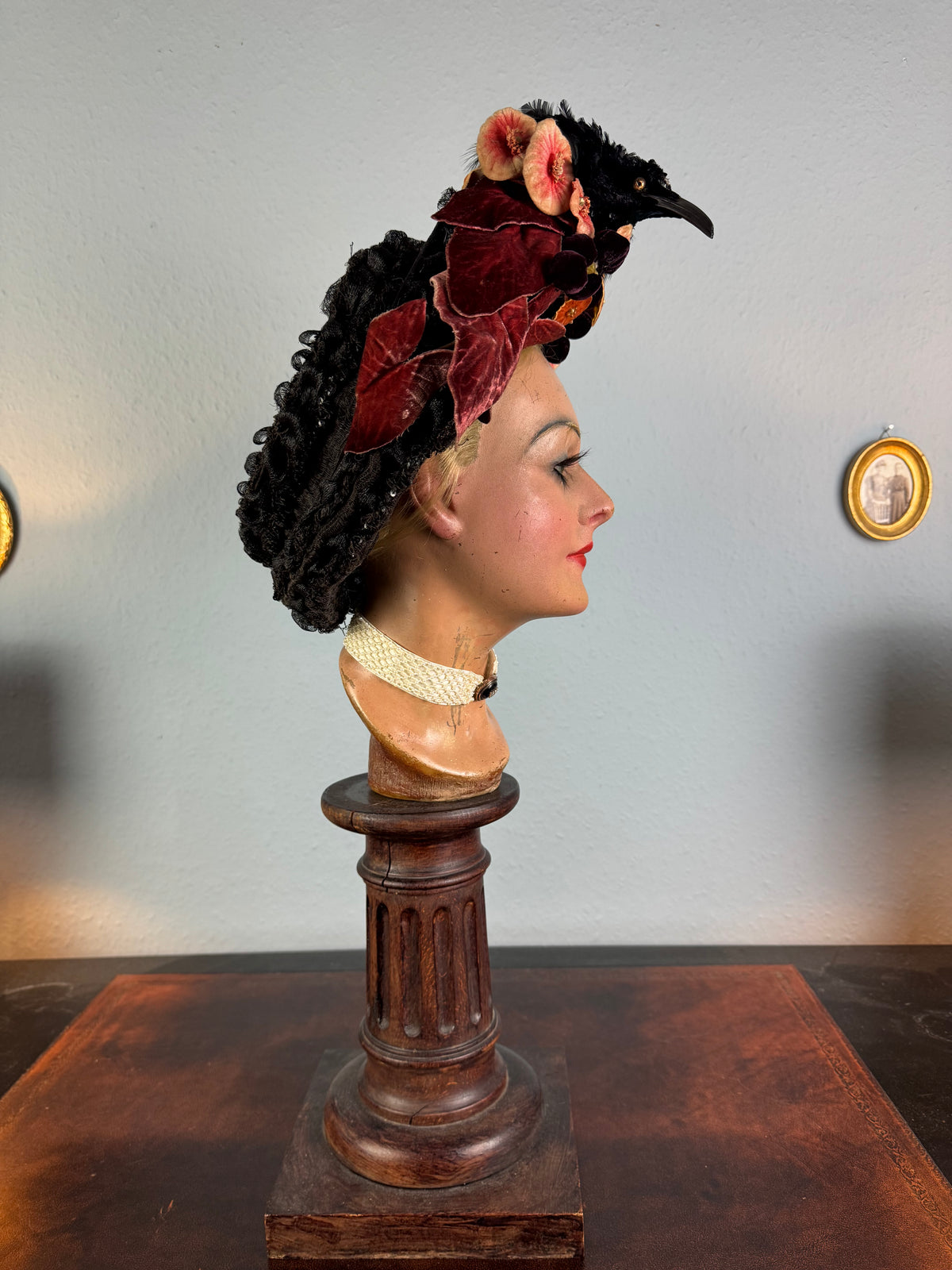 Autumn antique hat with exotic bird decoration, black lace and foliage, early 20th century