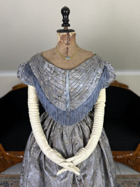 1845 Austrian Biedermeier evening dress in ivory silk with puffed sleeves and fitted bodice, antique gown