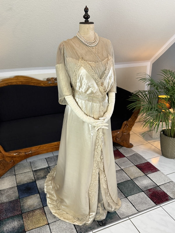 Early 20th‑century Almera Robes London dress with beaded belt, tulle sleeves and long lace train, antique couture gown