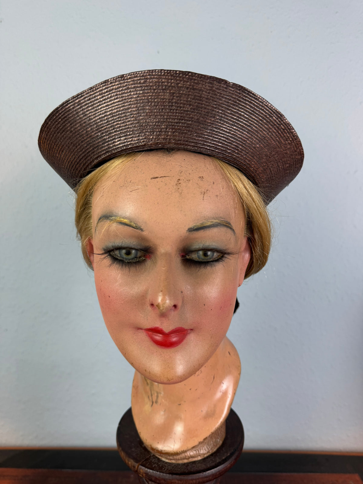 Small French brown straw hat with two back ribbons, sailor‑style shape, well preserved
