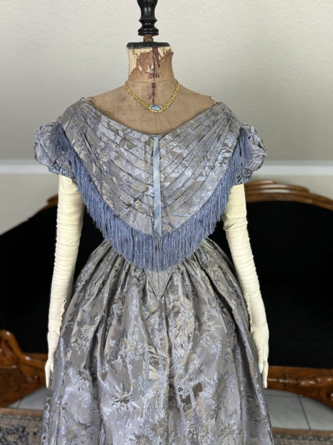 1845 Austrian Biedermeier evening dress in ivory silk with puffed sleeves and fitted bodice, antique gown