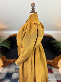 Regency gold moiré silk gown, ca. 1815–1820, high waistline with elegant neoclassical silhouette