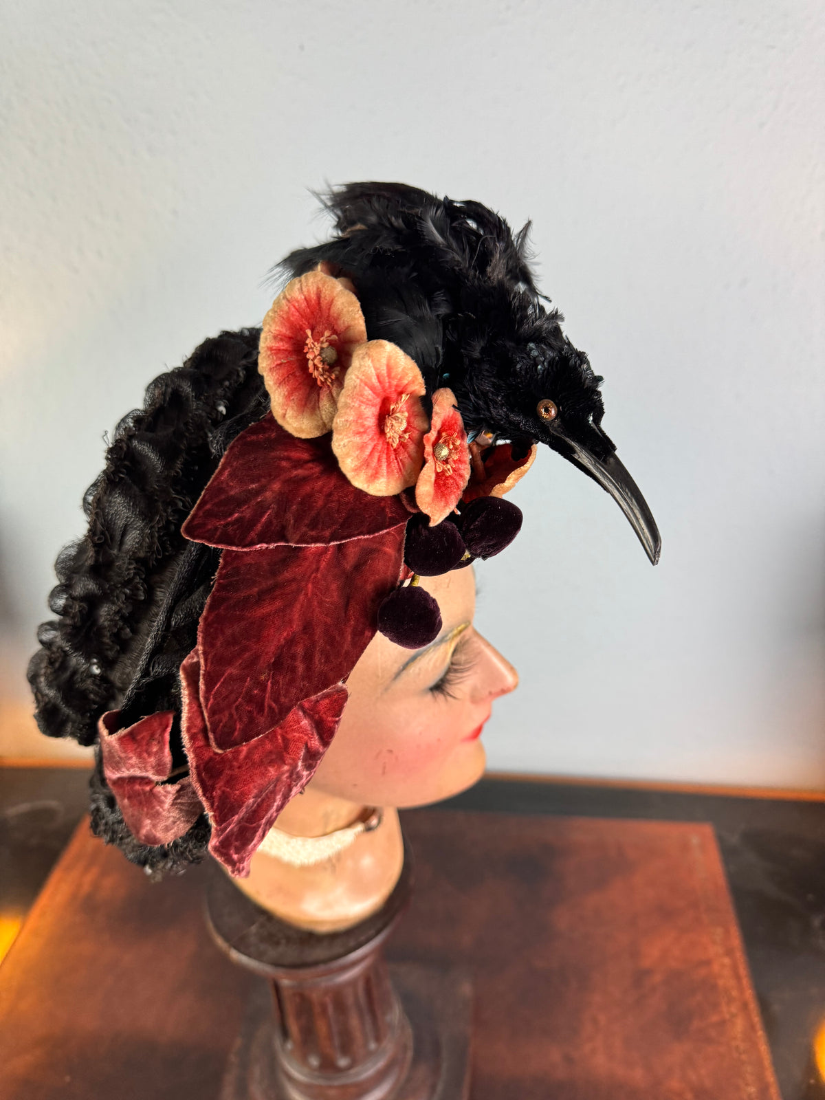 Autumn antique hat with exotic bird decoration, black lace and foliage, early 20th century