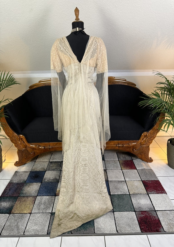 1912 Titanic‑era antique evening dress in ivory silk with lace bodice, draped skirt and rhinestone details, antique gown