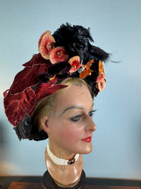 Autumn antique hat with exotic bird decoration, black lace and foliage, early 20th century