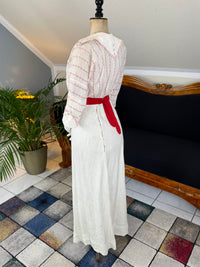 Natural Fiber Daywear Set — Linen skirt, red‑pattern cotton blouse with sailor collar, white leather shoes, red belt.