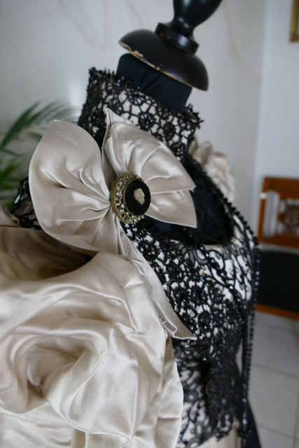 Antique silk dress 1890s — detailed view of sleeves, lace and fabric texture