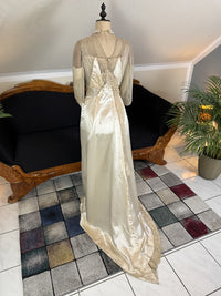 Early 20th‑century Almera Robes London dress with beaded belt, tulle sleeves and long lace train, antique couture gown