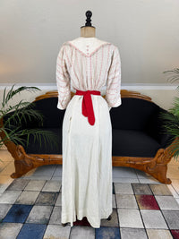 Natural Fiber Daywear Set — Linen skirt, red‑pattern cotton blouse with sailor collar, white leather shoes, red belt.