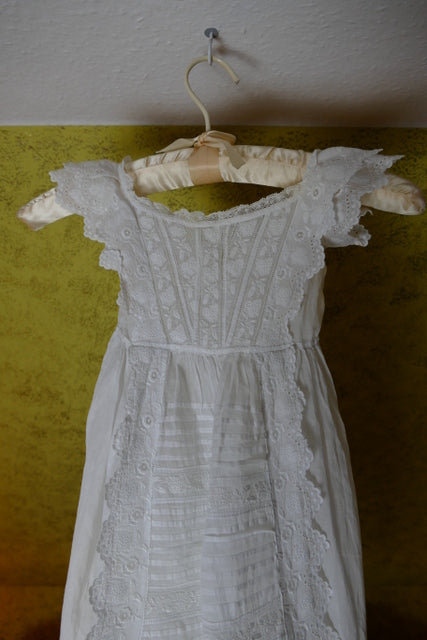 Edwardian christening gown ca. 1910 with white embroidery and pleated front