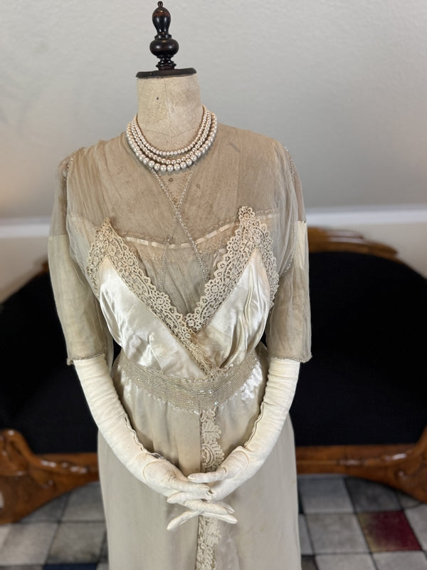 Early 20th‑century Almera Robes London dress with beaded belt, tulle sleeves and long lace train, antique couture gown