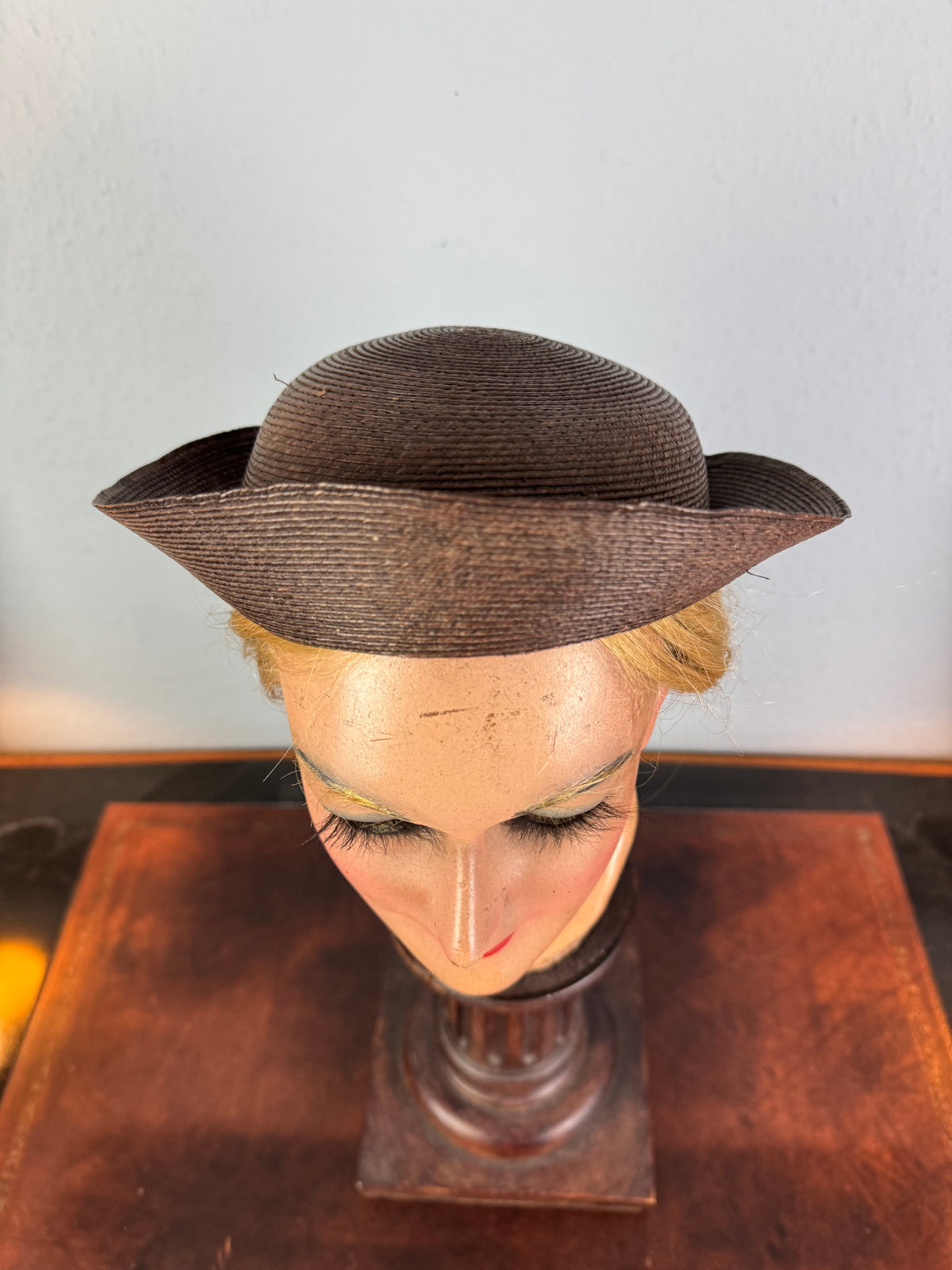 Small French brown straw hat with two back ribbons, sailor‑style shape, well preserved
