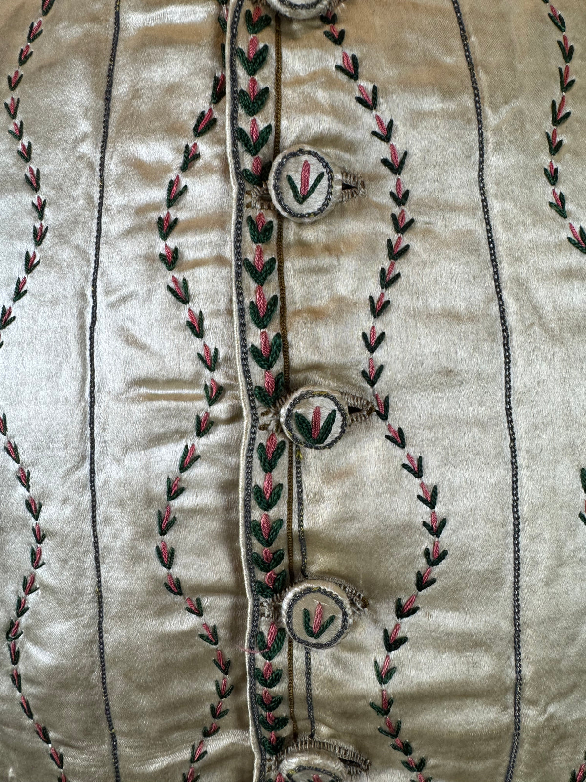 Cream silk embroidered Georgian waistcoat c.1770 from England with long‑line silhouette and floral detailing.