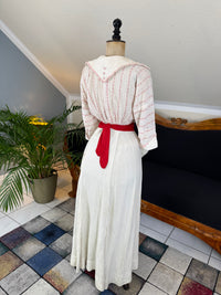 Natural Fiber Daywear Set — Linen skirt, red‑pattern cotton blouse with sailor collar, white leather shoes, red belt.