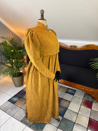 Regency gold moiré silk gown, ca. 1815–1820, high waistline with elegant neoclassical silhouette
