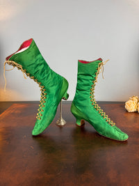 Victorian green silk lace‑up boots, c.1875, with brass fasteners, red leather lining and vivid aniline‑dyed colour