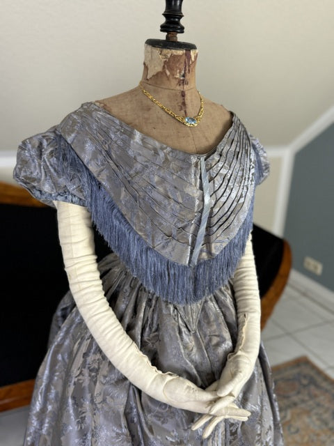 1845 Austrian Biedermeier evening dress in ivory silk with puffed sleeves and fitted bodice, antique gown