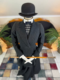 Early 20th‑century British riding ensemble with black wool jacket, skirt and antique accessories