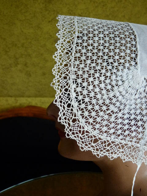 19th‑century Alsace lace bonnet with short chin ties