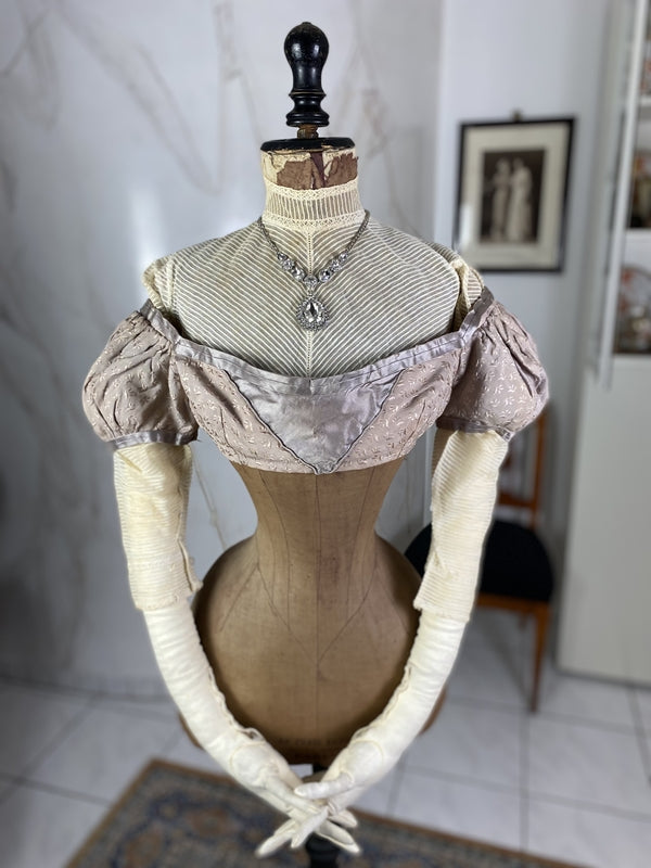1805 white silk Regency Spencer with short sleeves, high waistline and decorative front closure, antique garment