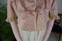 1795 French Directoire silk Spencer in cream tones with long sleeves and decorative front seams, antique garment