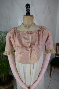 1795 French Directoire silk Spencer in cream tones with long sleeves and decorative front seams, antique garment
