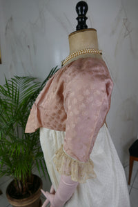 1795 French Directoire silk Spencer in cream tones with long sleeves and decorative front seams, antique garment
