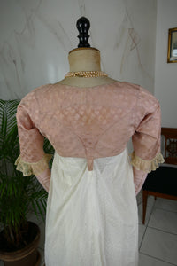 1795 French Directoire silk Spencer in cream tones with long sleeves and decorative front seams, antique garment