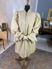 1906 Edwardian wool coat — shoulder area with passe‑partout trim