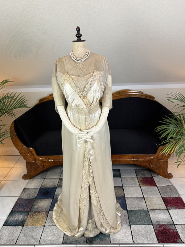 Early 20th‑century Almera Robes London dress with beaded belt, tulle sleeves and long lace train, antique couture gown